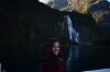 A profile picture of Madison in front of one of New Zealand's many waterfalls