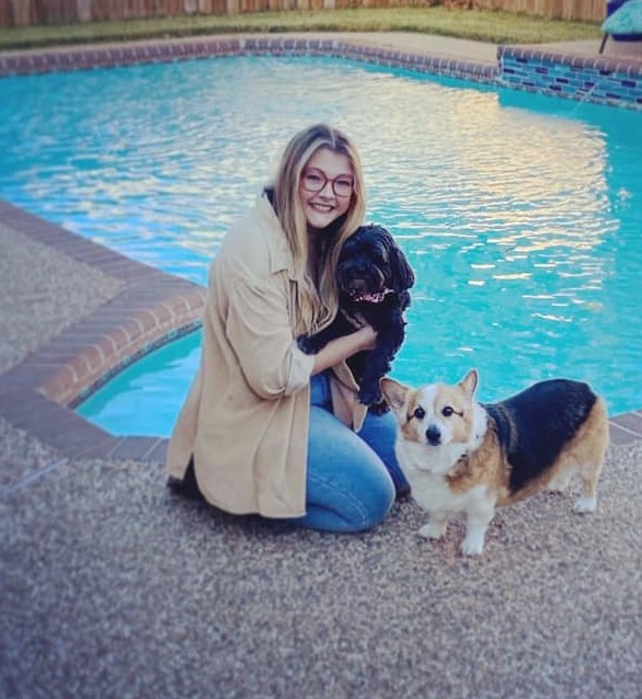 New advisor, Jaclyn Denny with her two dogs