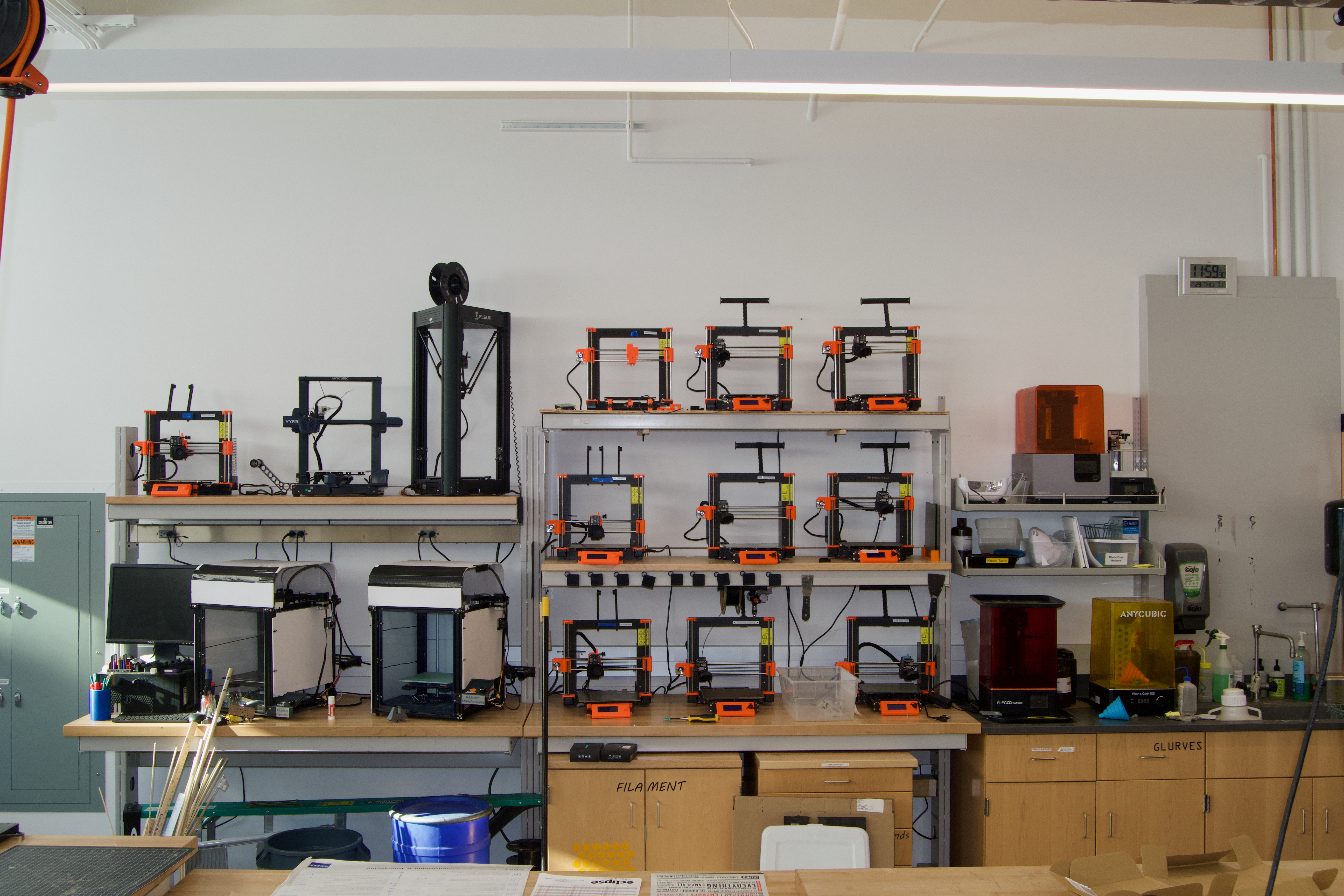 A wall of 3D printers available for use in the Makerspace