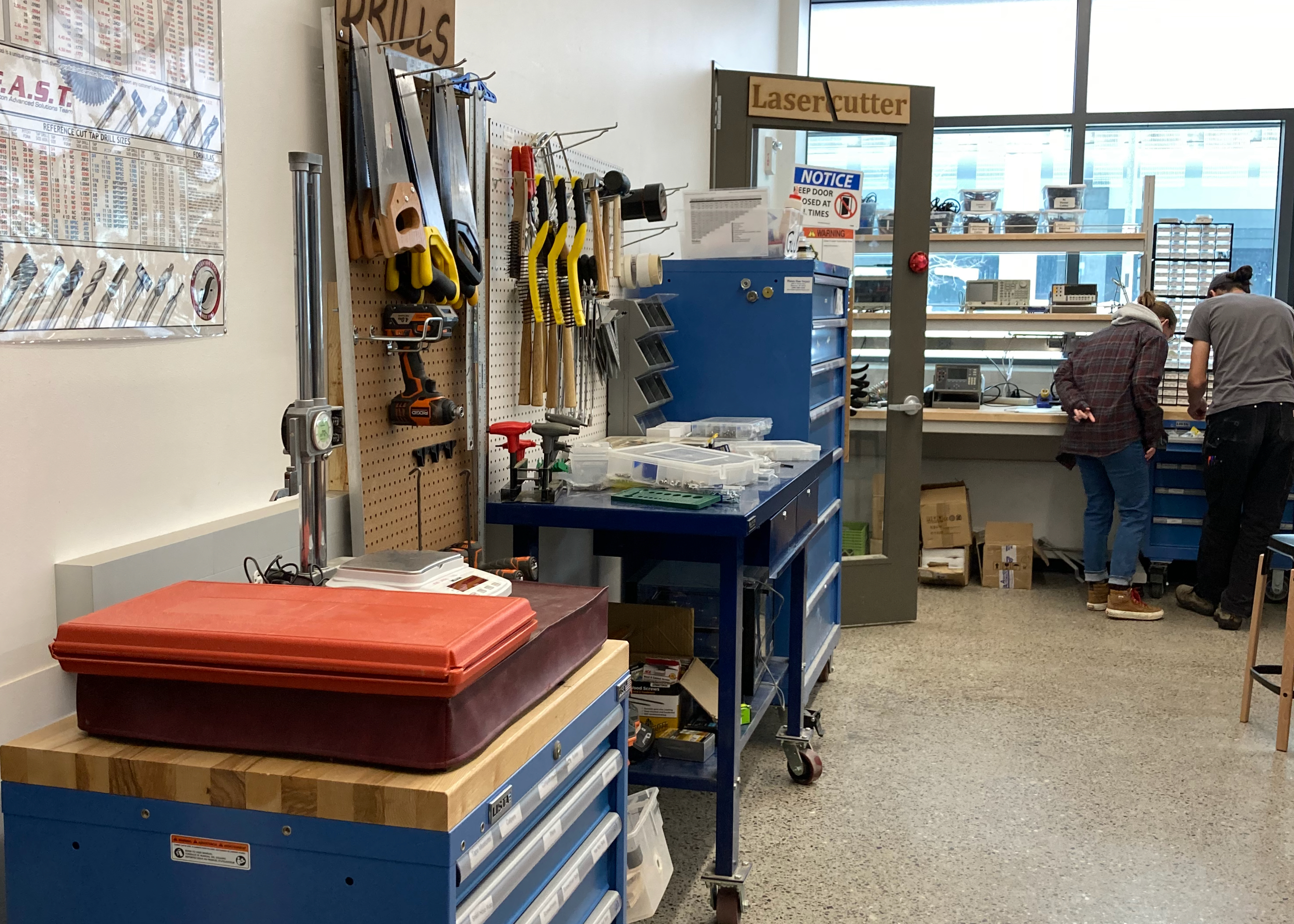 Hand tools can be seen in the foreground with electronic tools in the background