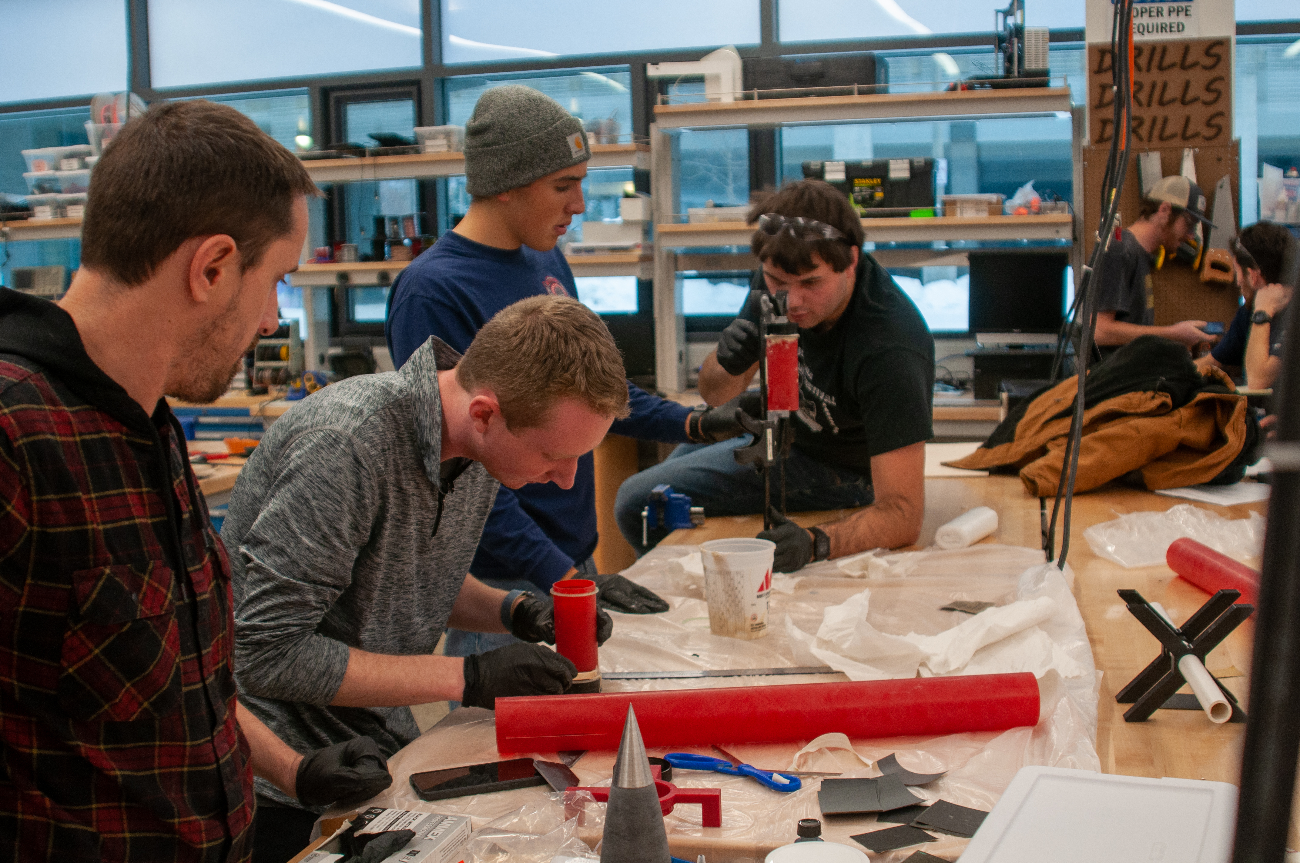 Students work together building rockets in the Makerspace