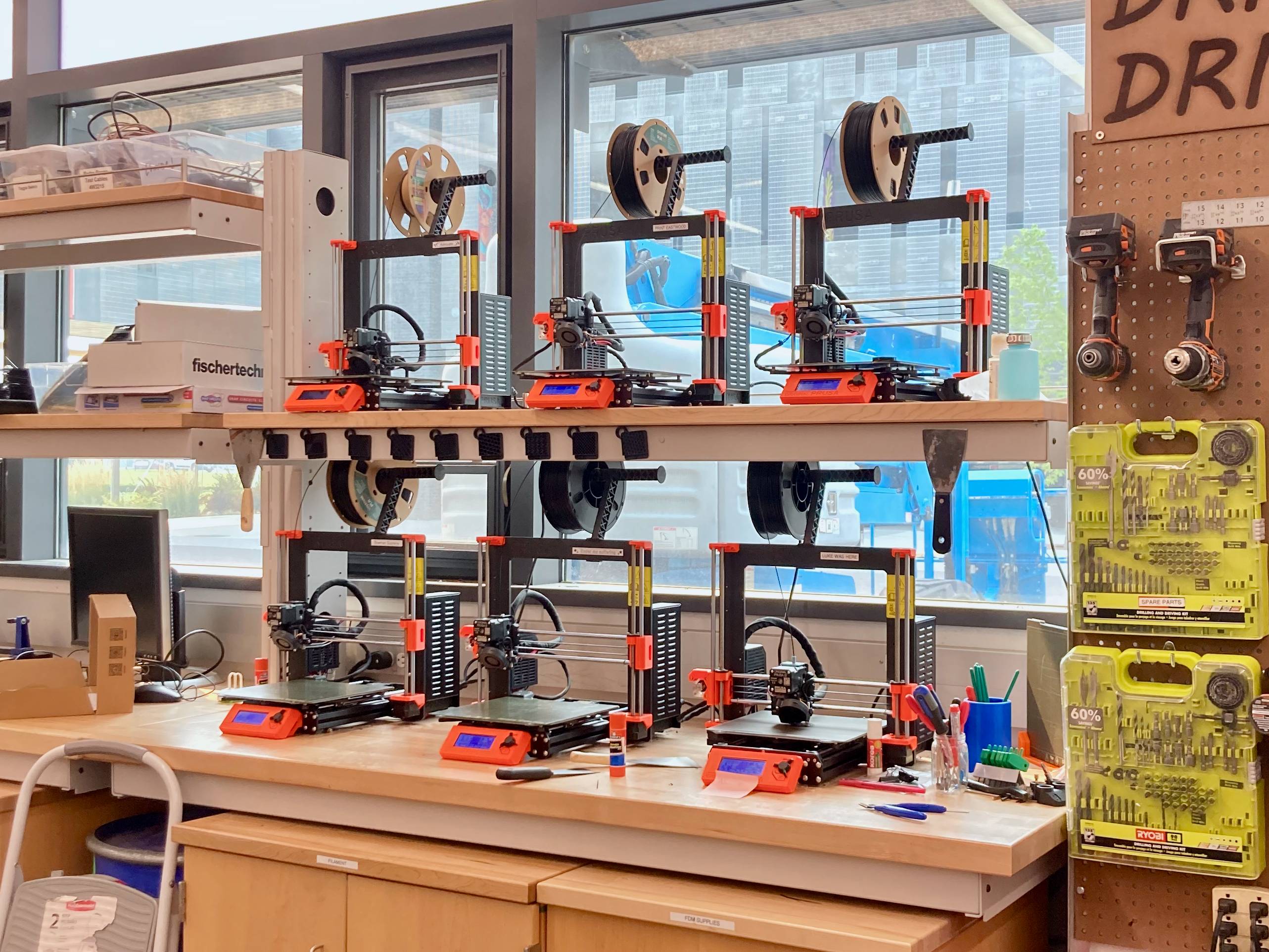 6 3d printers on shelves