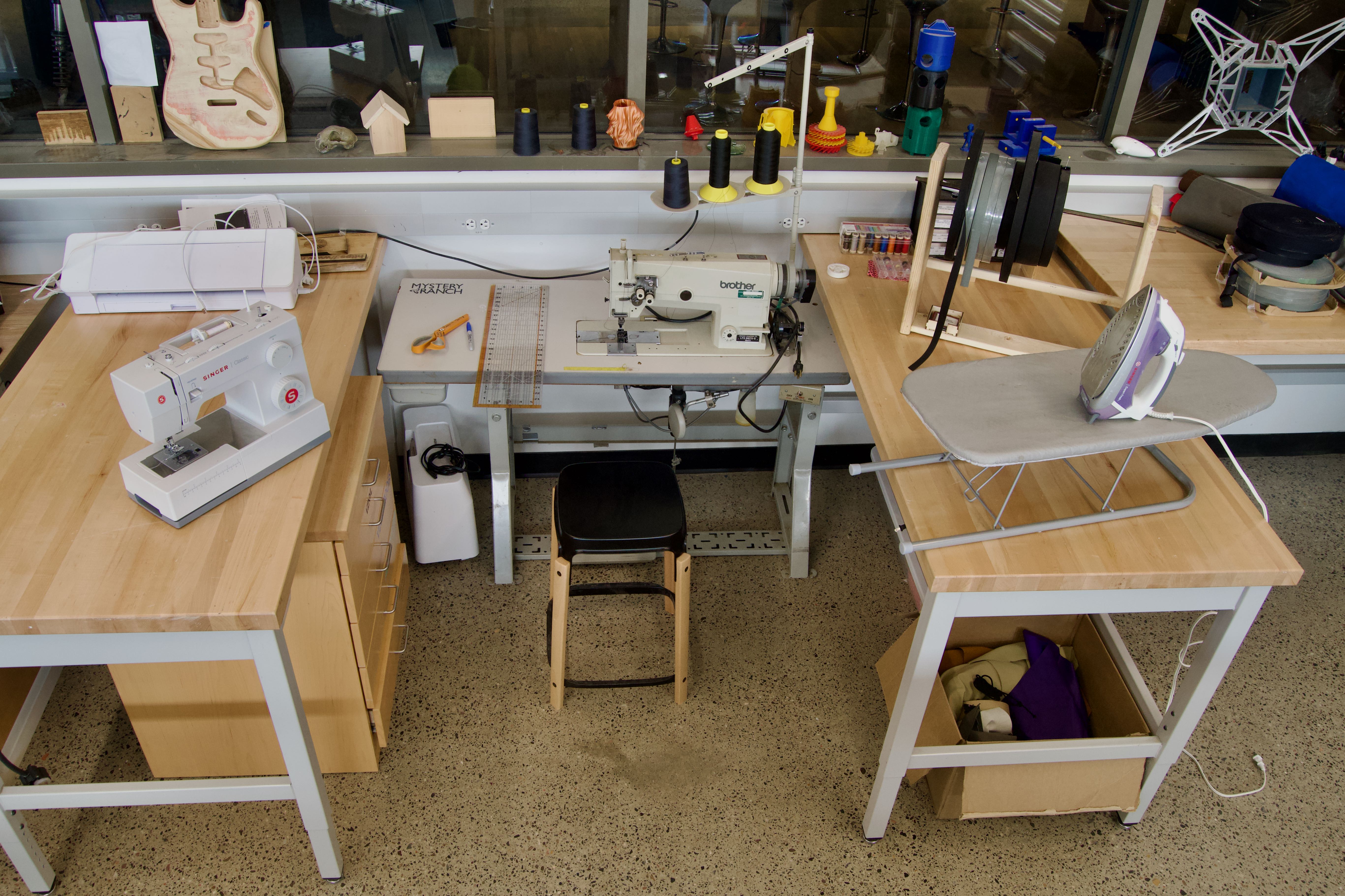 Sewing machines and an iron viewed from above