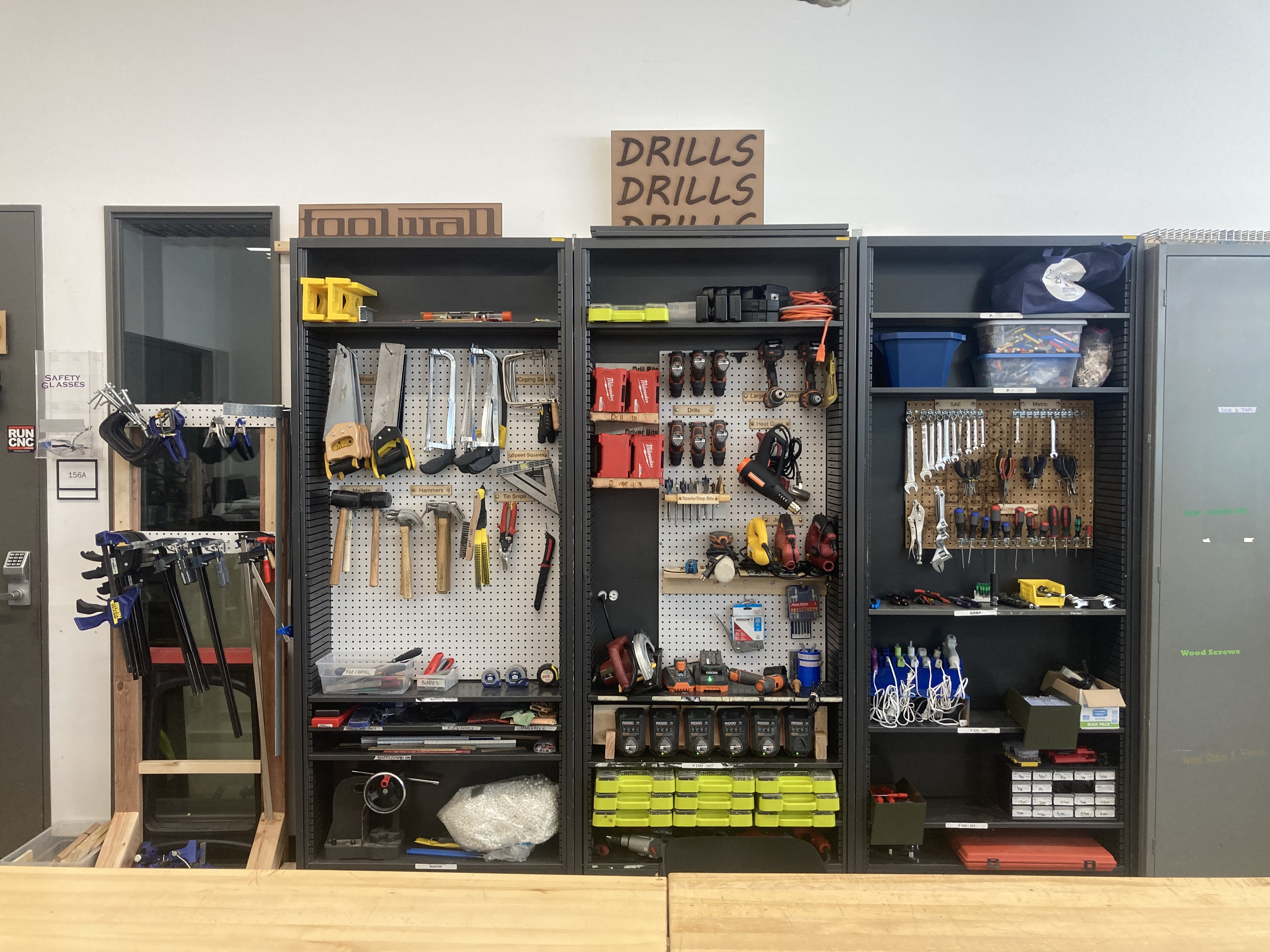 Hand tools on pegboard and in drawers