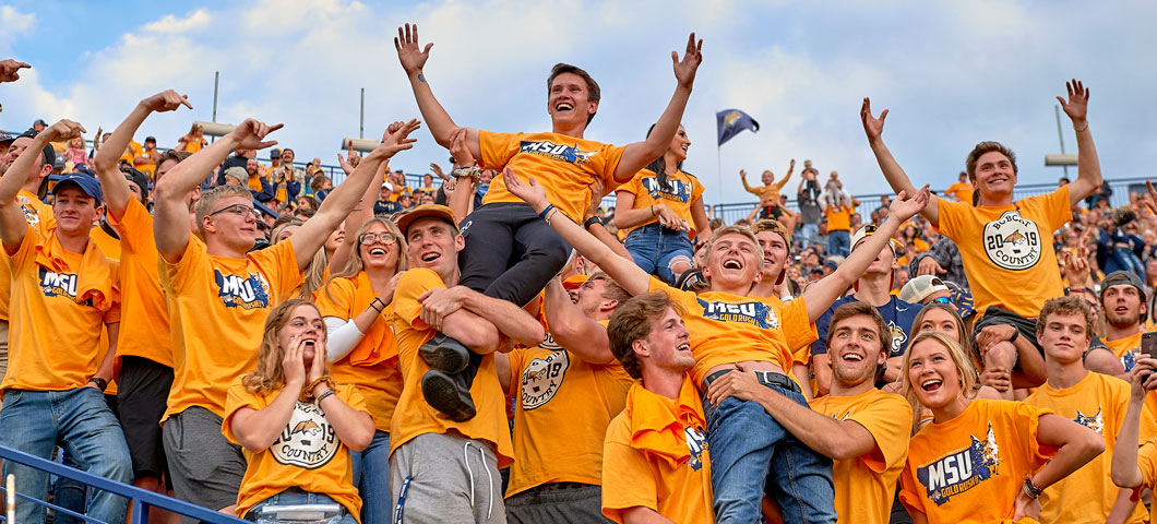 Photo of Gold Rush game and the many licensed t-shirts that are approved through University Communications Marketing