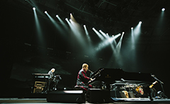 Elton John performing in concert