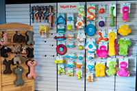 West Paw dog toys displayed on wall