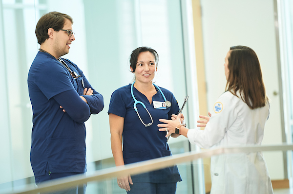 Three nurses in scrubs