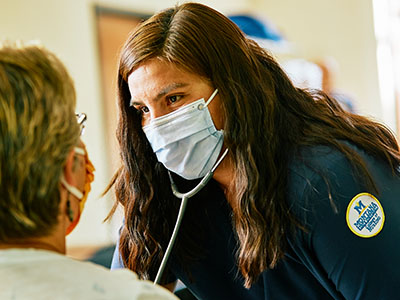 American Indian Nurse listening to the heart