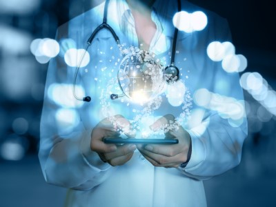 nurse on ipad with graphic