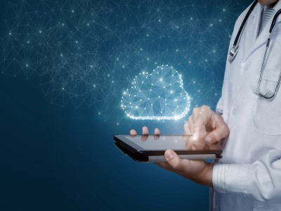nurse on ipad with graphics