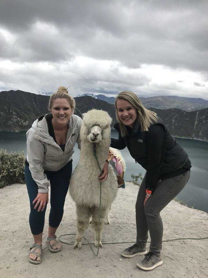 nursing student with llama in Ecuador