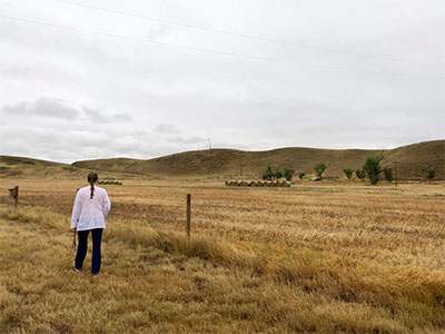 rural nurse walking in a field