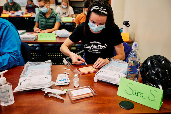 Nursing student doing sutures