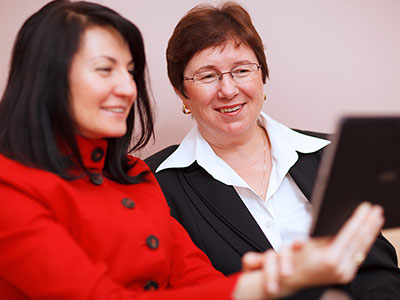 Two women looking at a tablet computer