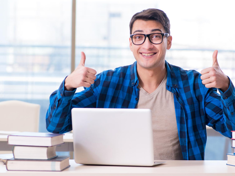 guys with laptop thumbs up guys with laptop thumbs up
