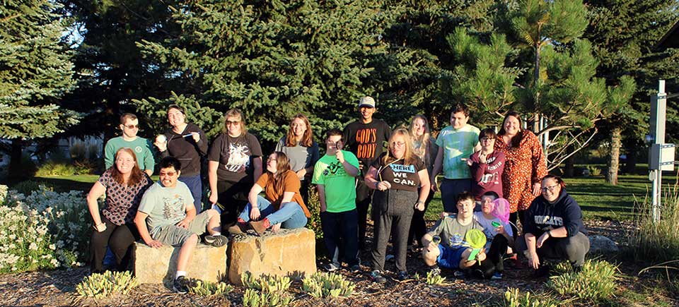 Group of citizen science educators and youth in a park