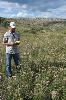 Tyler standing in a field