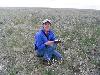 Jane kneeling in a field