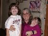 Tracy and two young girls posing for a photo