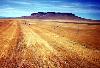 Dirt roadway with a plateau in the background