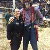 police posing with rodeo cowboy