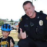 police posing with child