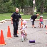 child learning to ride bike