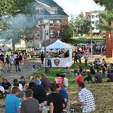 crowd gathers around police tent