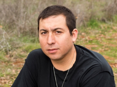 Tommy Orange, a man in a black T-shirt.