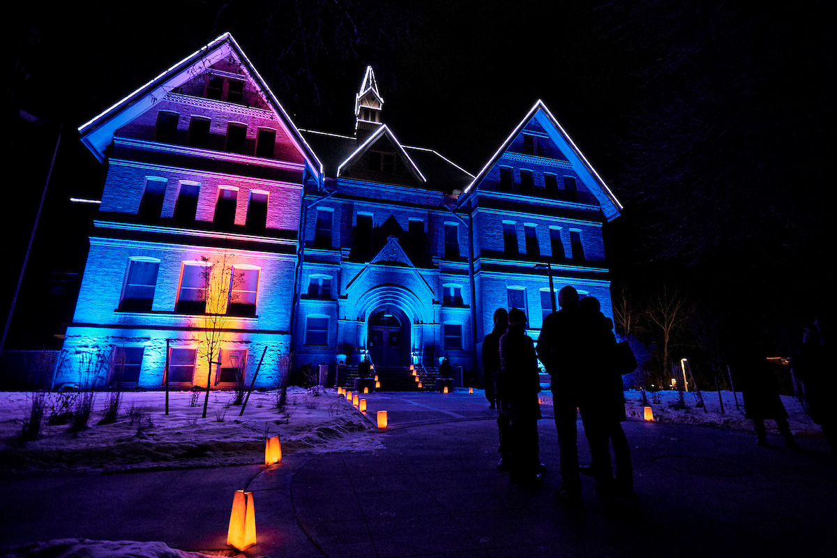 Montana State University's Montana Hall is seen lit with colorful lights for the holiday season.