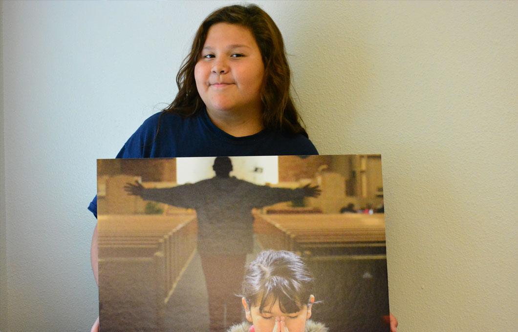 girl holding a painting