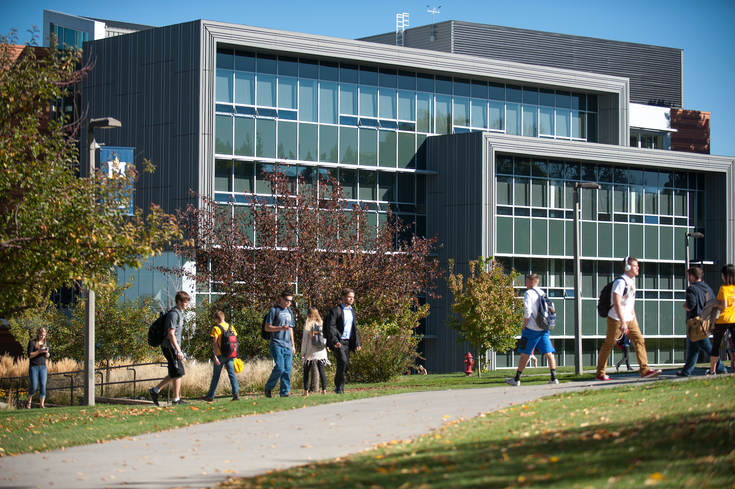 Students walking by building