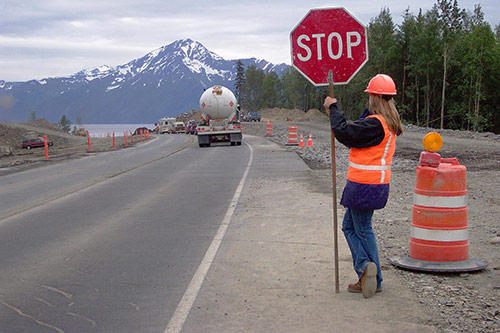 flagger on mountain road
