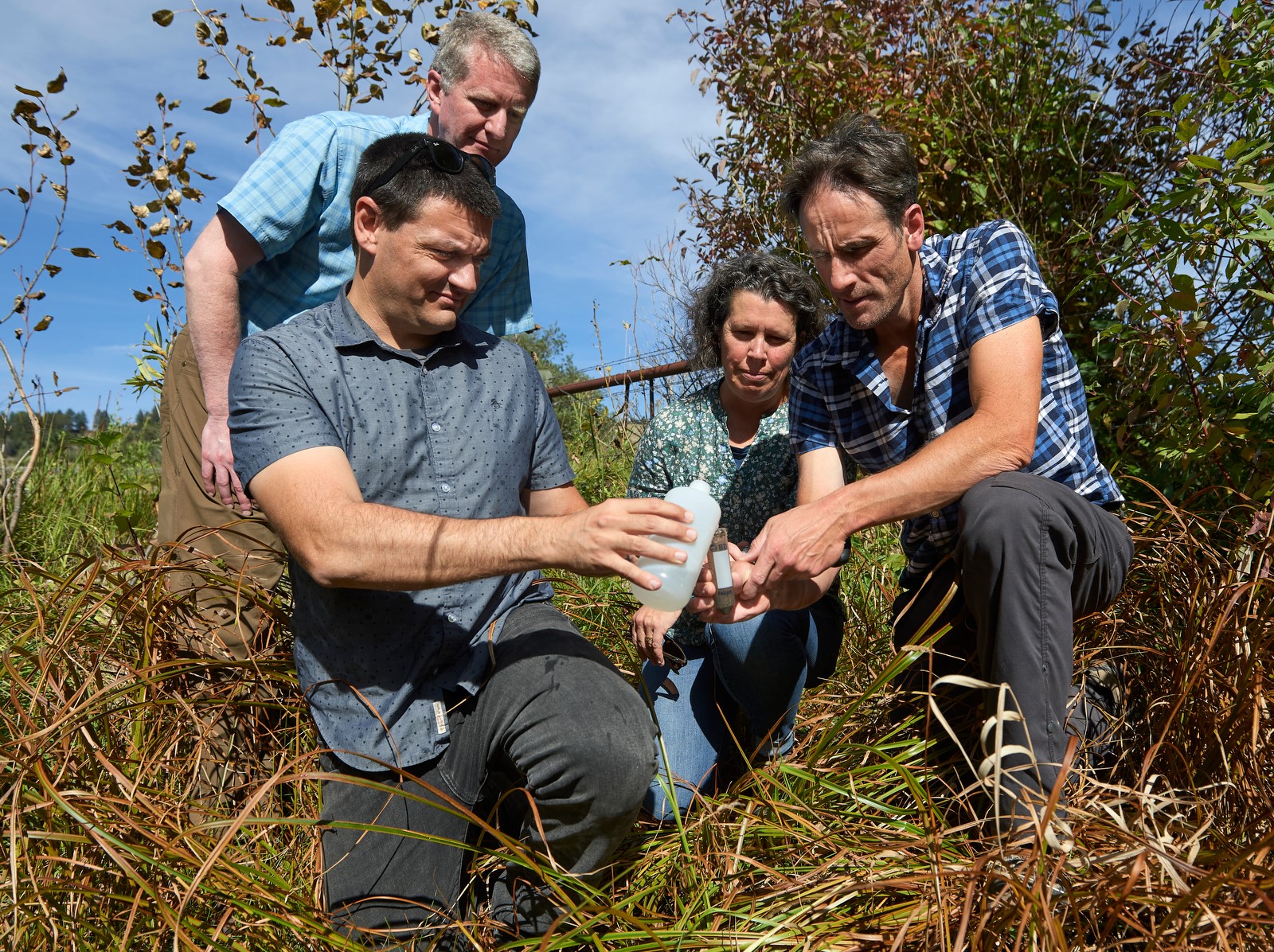 group of people with water sample