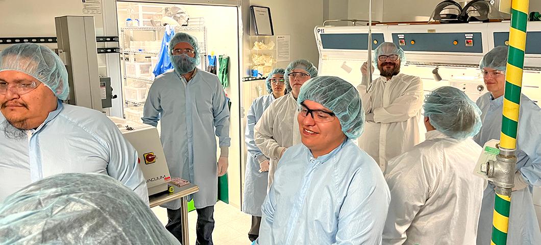 A group of undergraduate students from Montana's tribal and two-year colleges tour of the Montana Microfabrication Facility in Cobleigh Hall during the week of World Quantum Day.