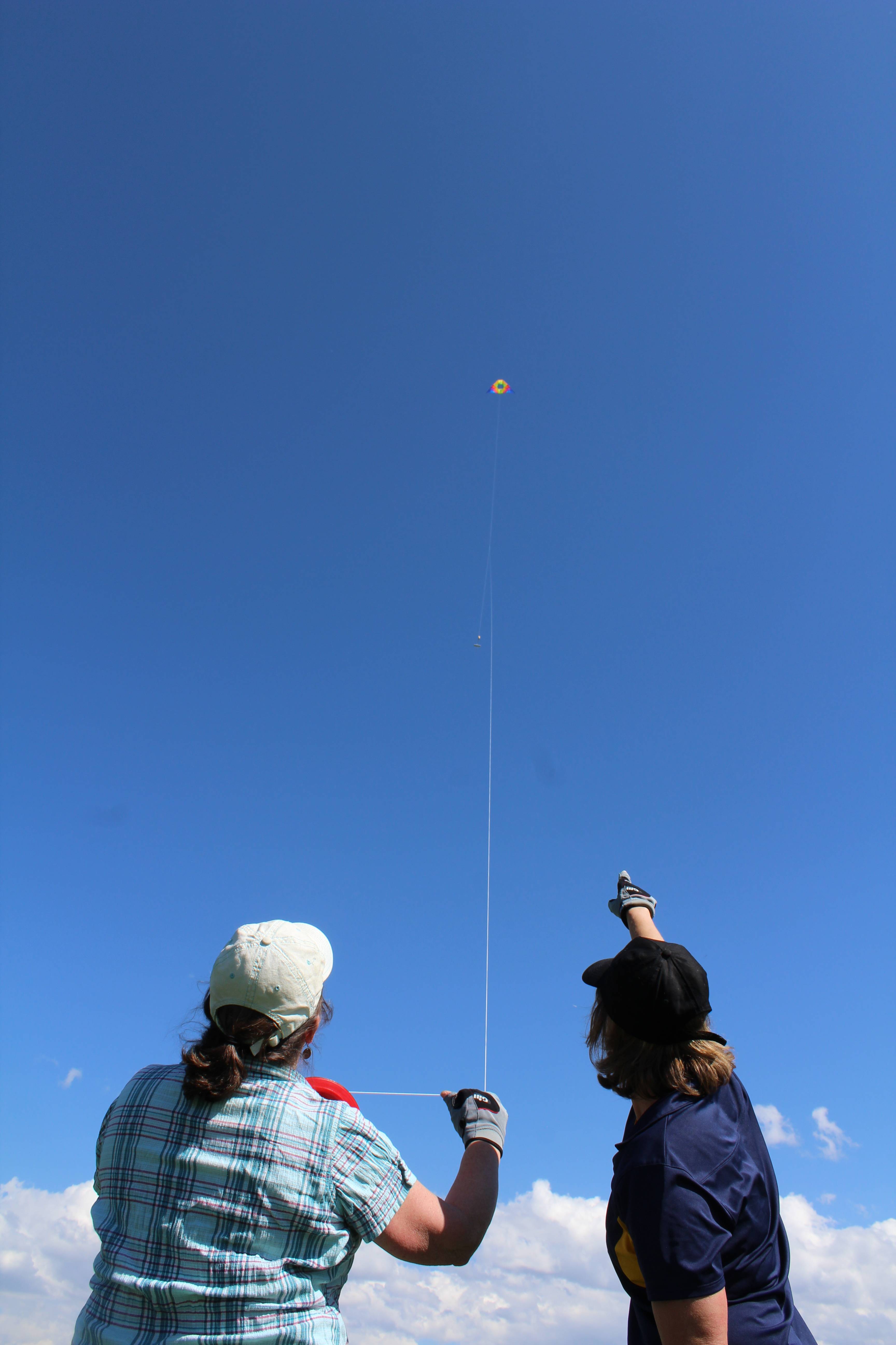 Two people flying a kite
