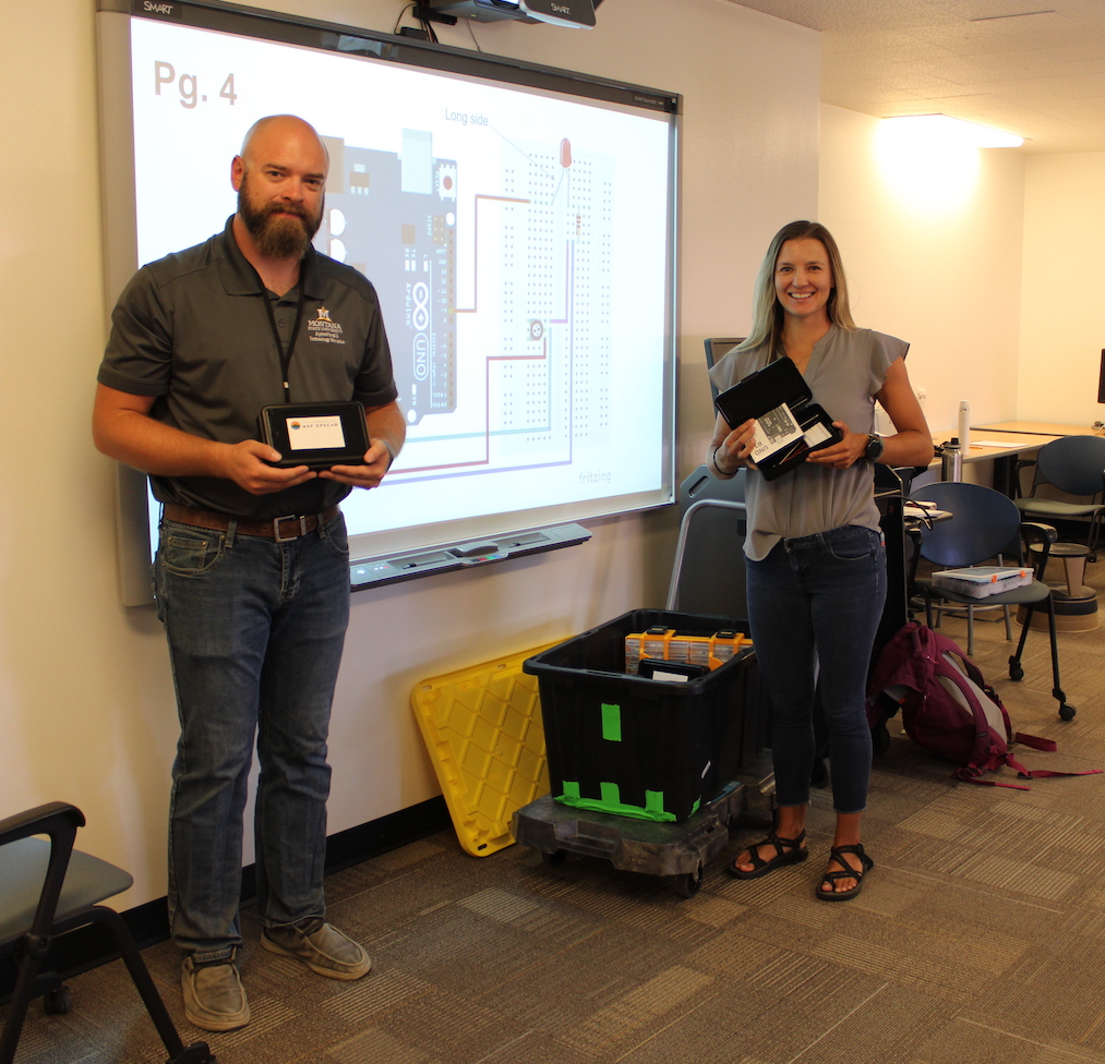 Teachers holding Arduino kit