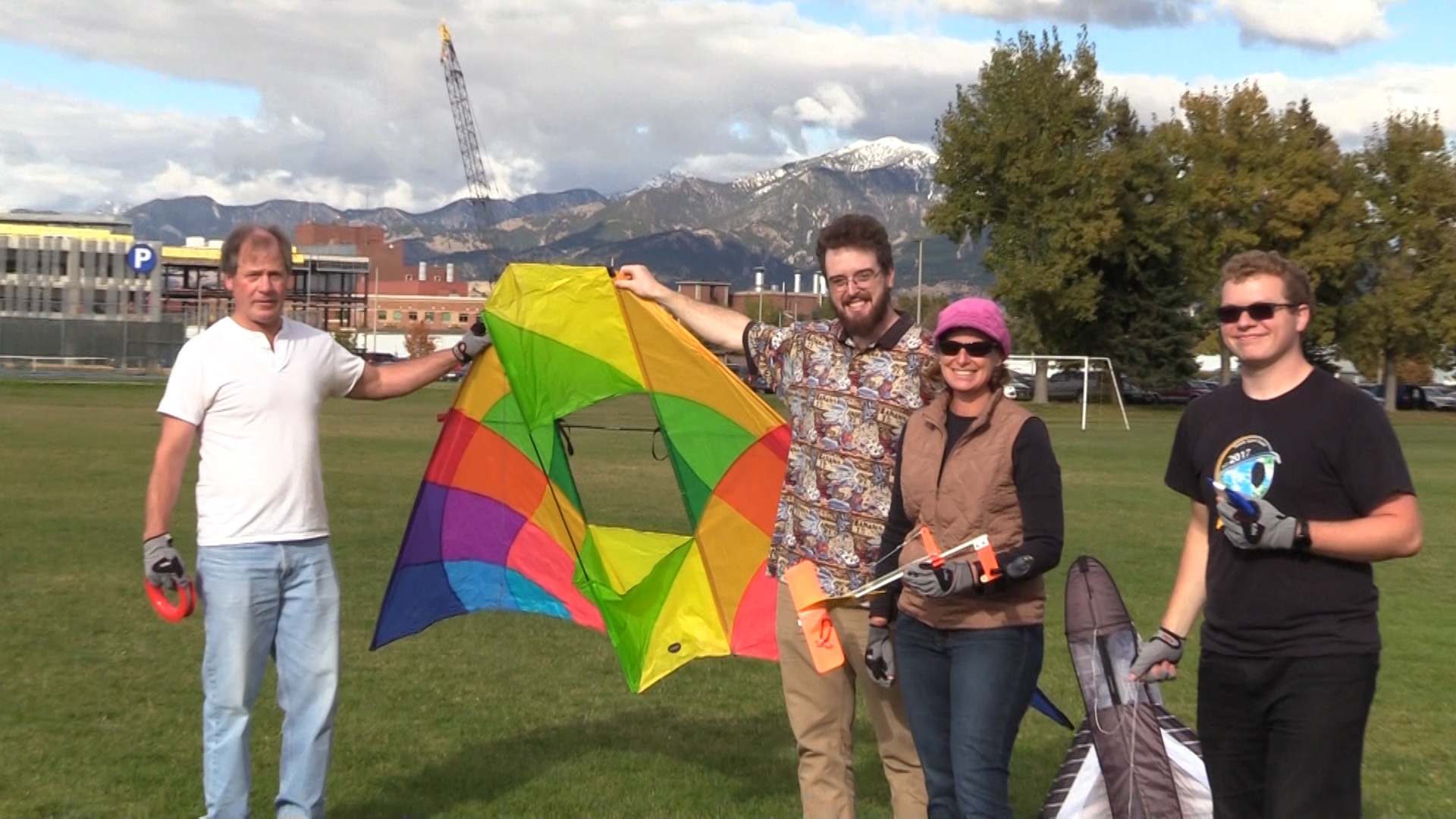 people holding a kite