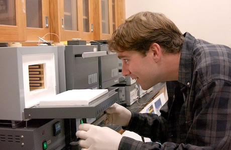 Paul Gannon opens a small laboratory oven