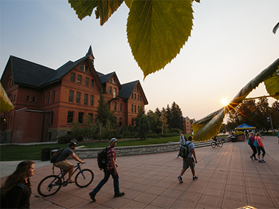 Students walk past Montana Hall