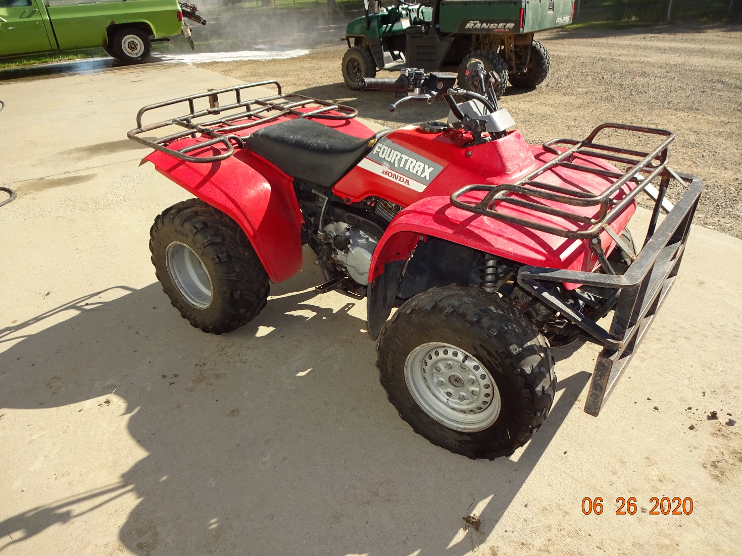 Side view of red ATV