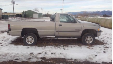 Side view of tan Dodge Ram pickup