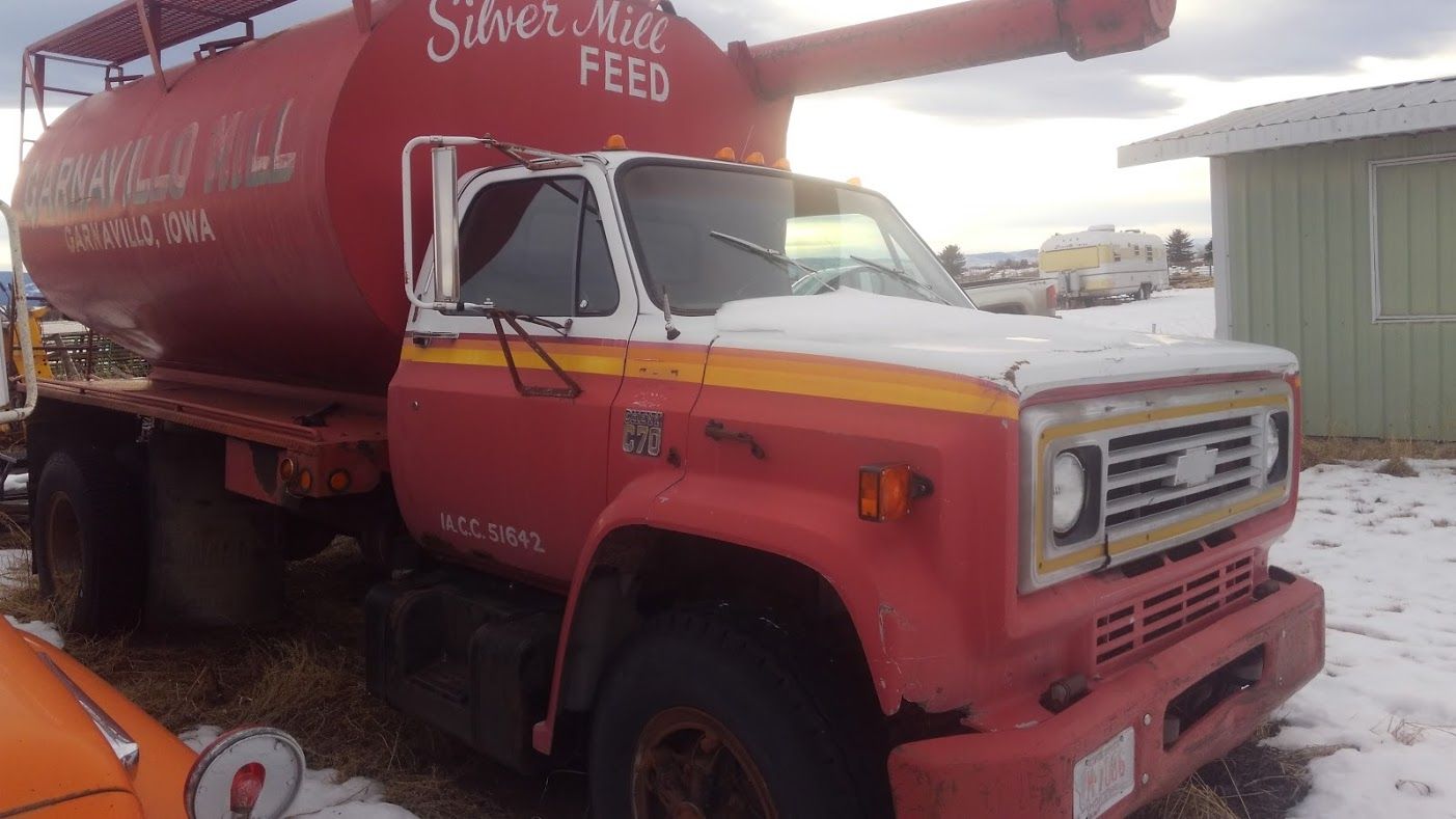 Red and white chevrolet feed truck