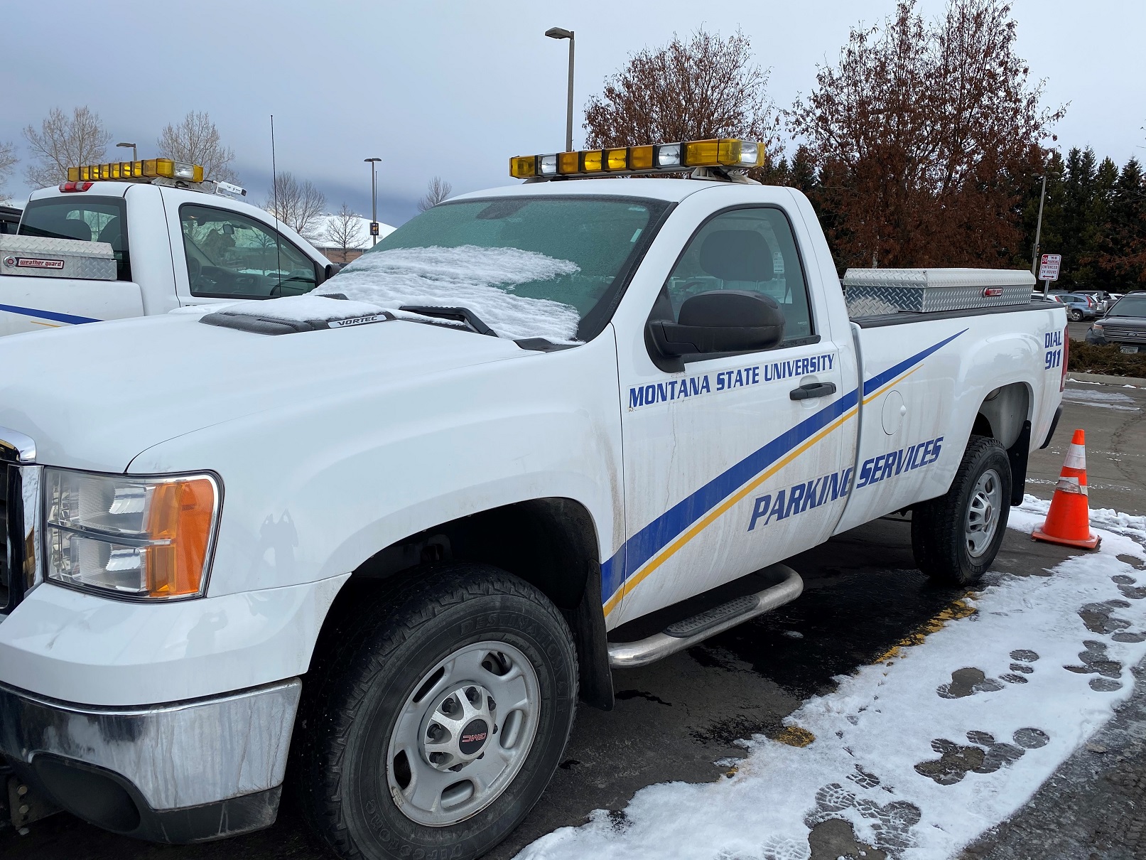 2012 GMC pickup with University Parking branding