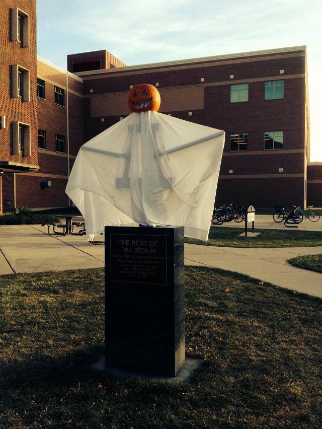 A photo of the Tau Beta Pi Bent decorated for Halloween 2014 sitting outside the Cobleigh courtyard at MSU.