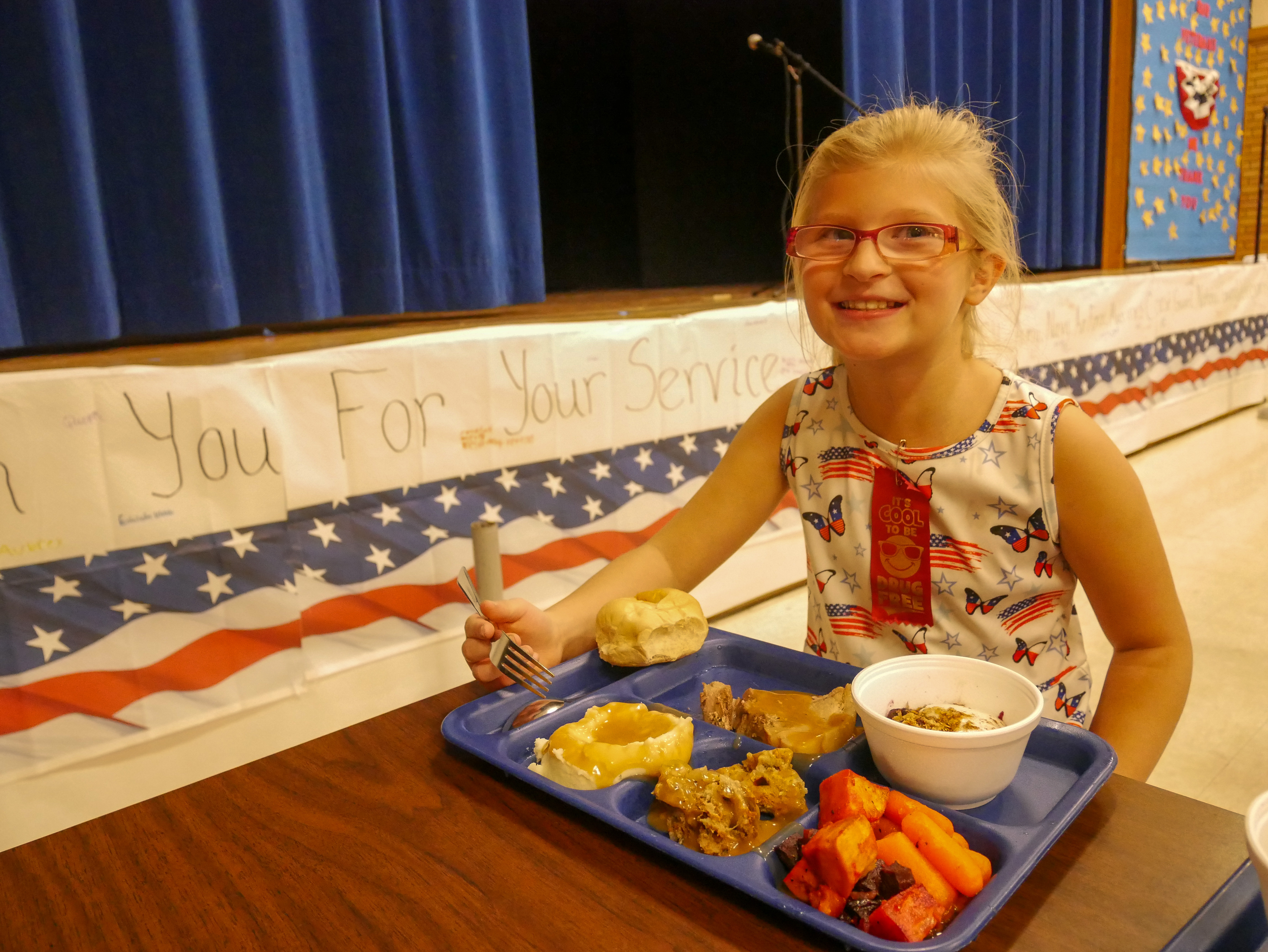 Photo of student with lunch tray