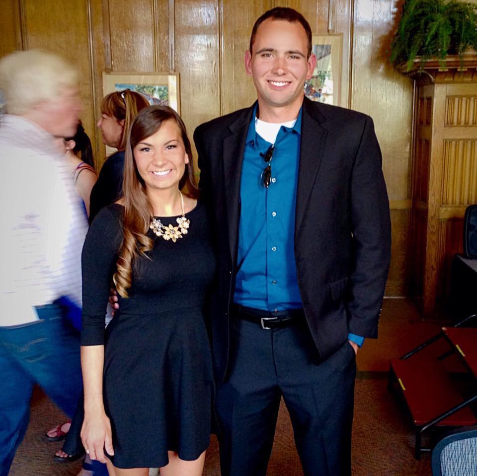 Stewart Rebecca Stewart (in black) standing next to a tall man