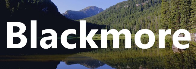 Blackmore logo with lake and mountain background
