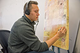 Student working on a canvas.